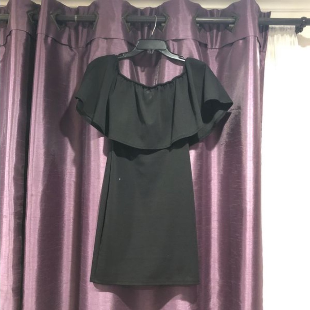 an off the shoulder fitted dress